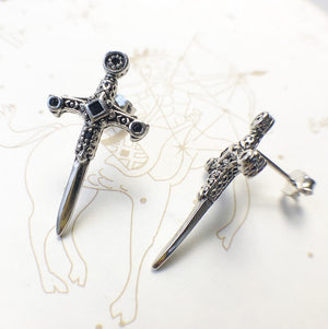 Silver-tone sword stud earrings in a closer product view