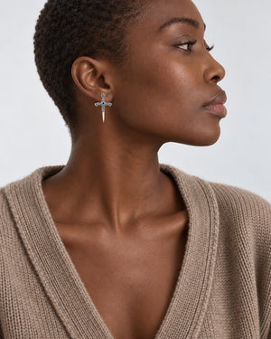 Sword Stud earrings worn at natural scale; AI-generated brand photograph