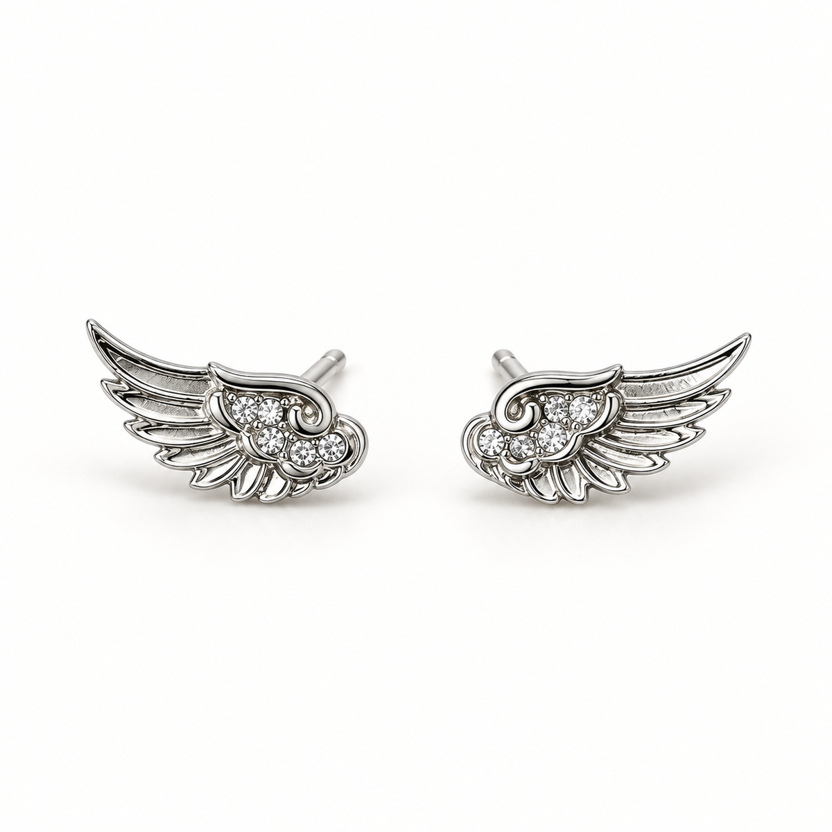 Silver-tone wing stud earrings on a plain light background
