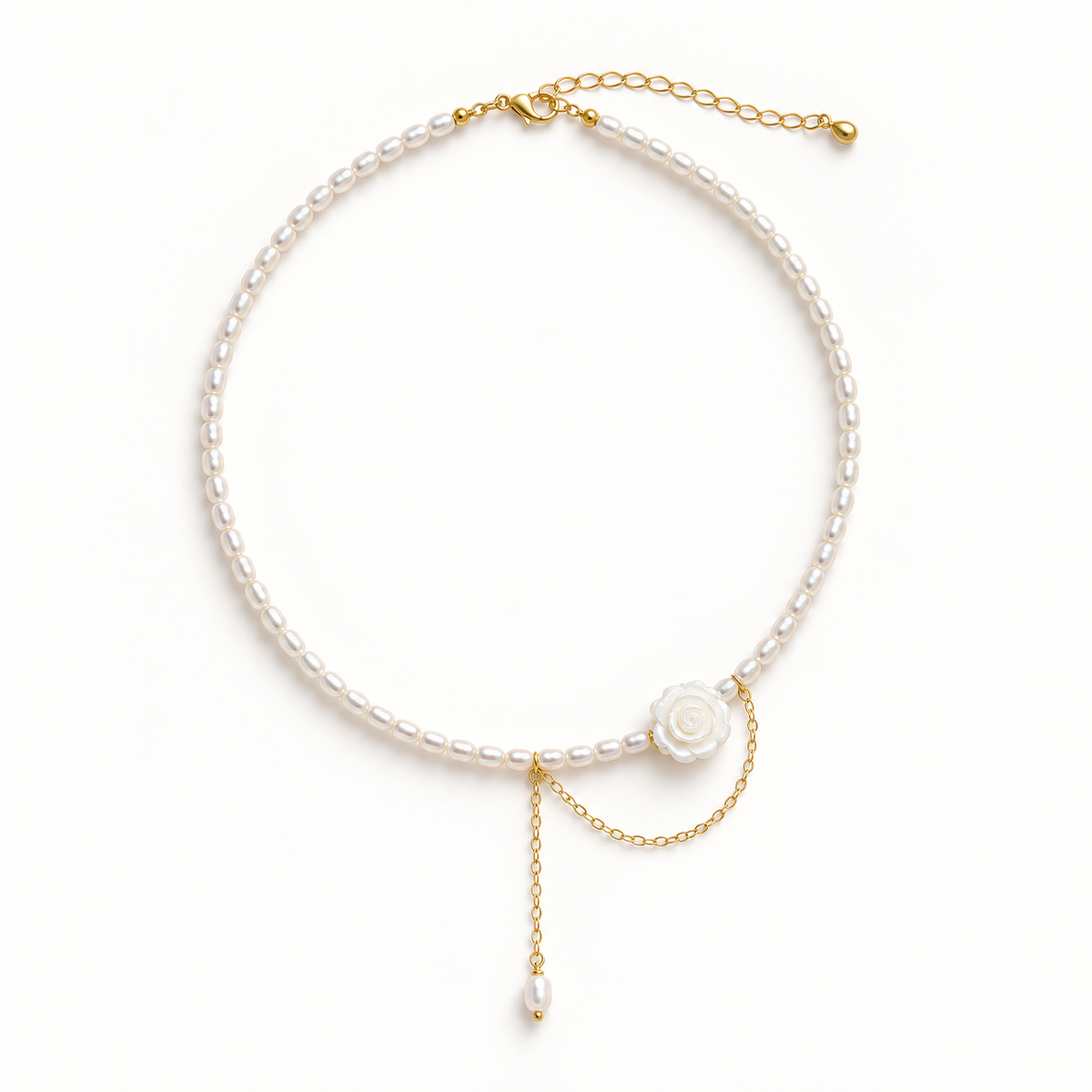 Gold-tone rose and bead necklace on a plain warm-white background