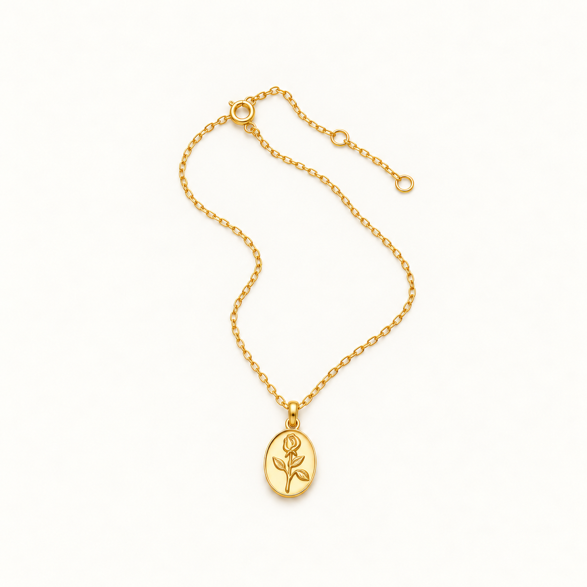 Gold-tone rose medallion necklace on a warm-white background