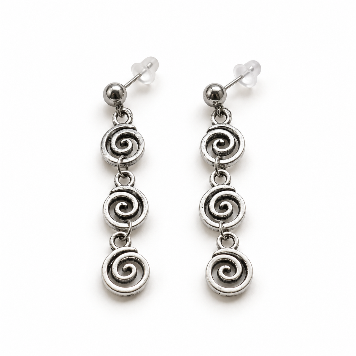 Silver-tone linked spiral earrings on a warm-white background