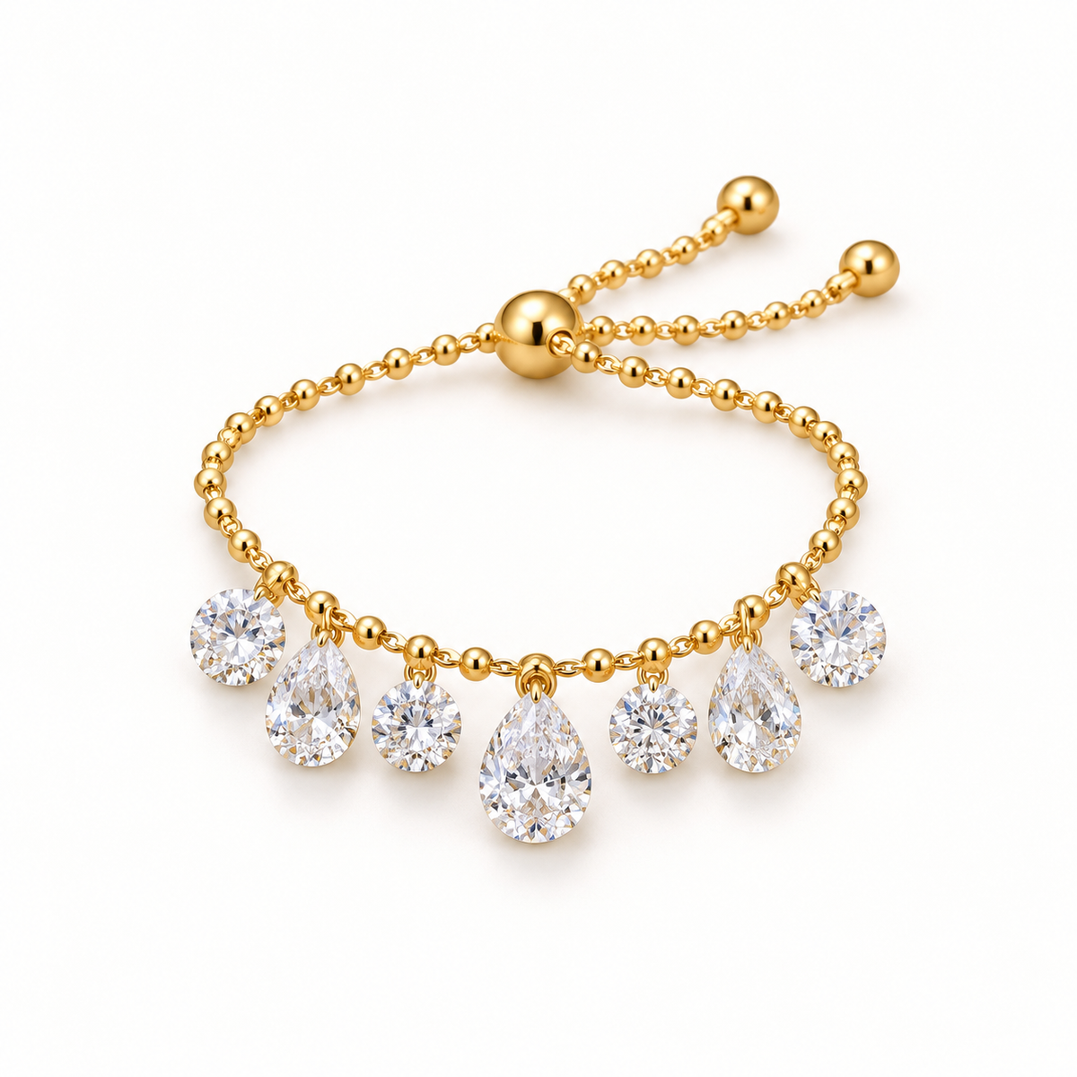 Gold-tone fringe ring on a plain warm-white background