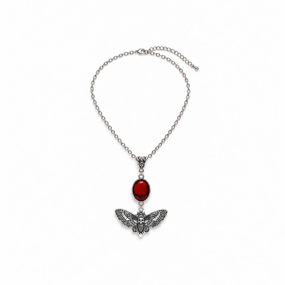 Silver-tone moth necklace on a warm-white background