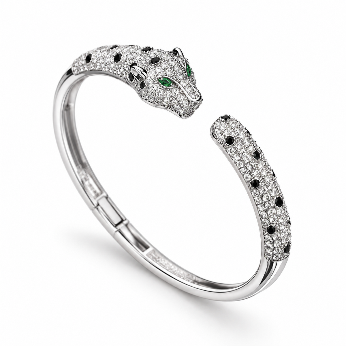 Silver-tone panther cuff bracelet on a warm-white background