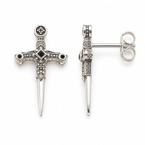 Silver-tone sword stud earrings on a plain white background; AI-generated brand photograph