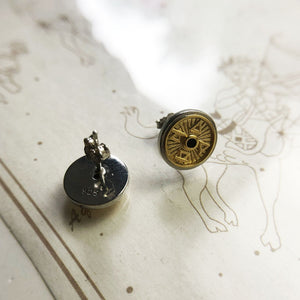Gold / Silver-tone element medallion stud earrings in a closer product view