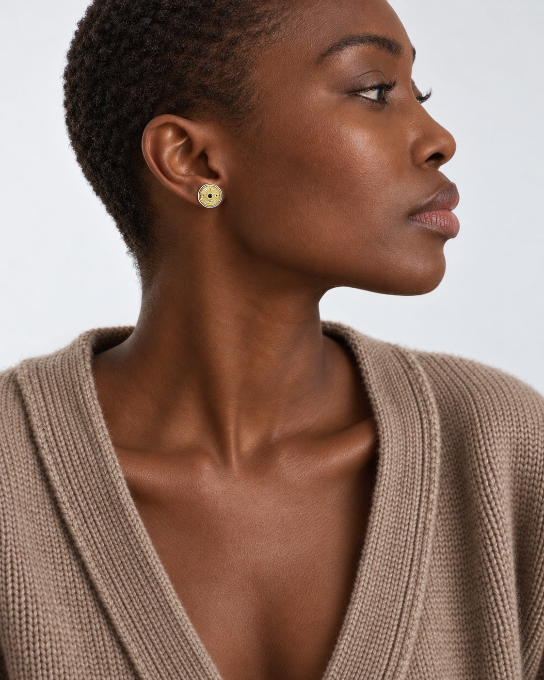 Element Medallion Stud earrings worn at natural scale; AI-generated brand photograph