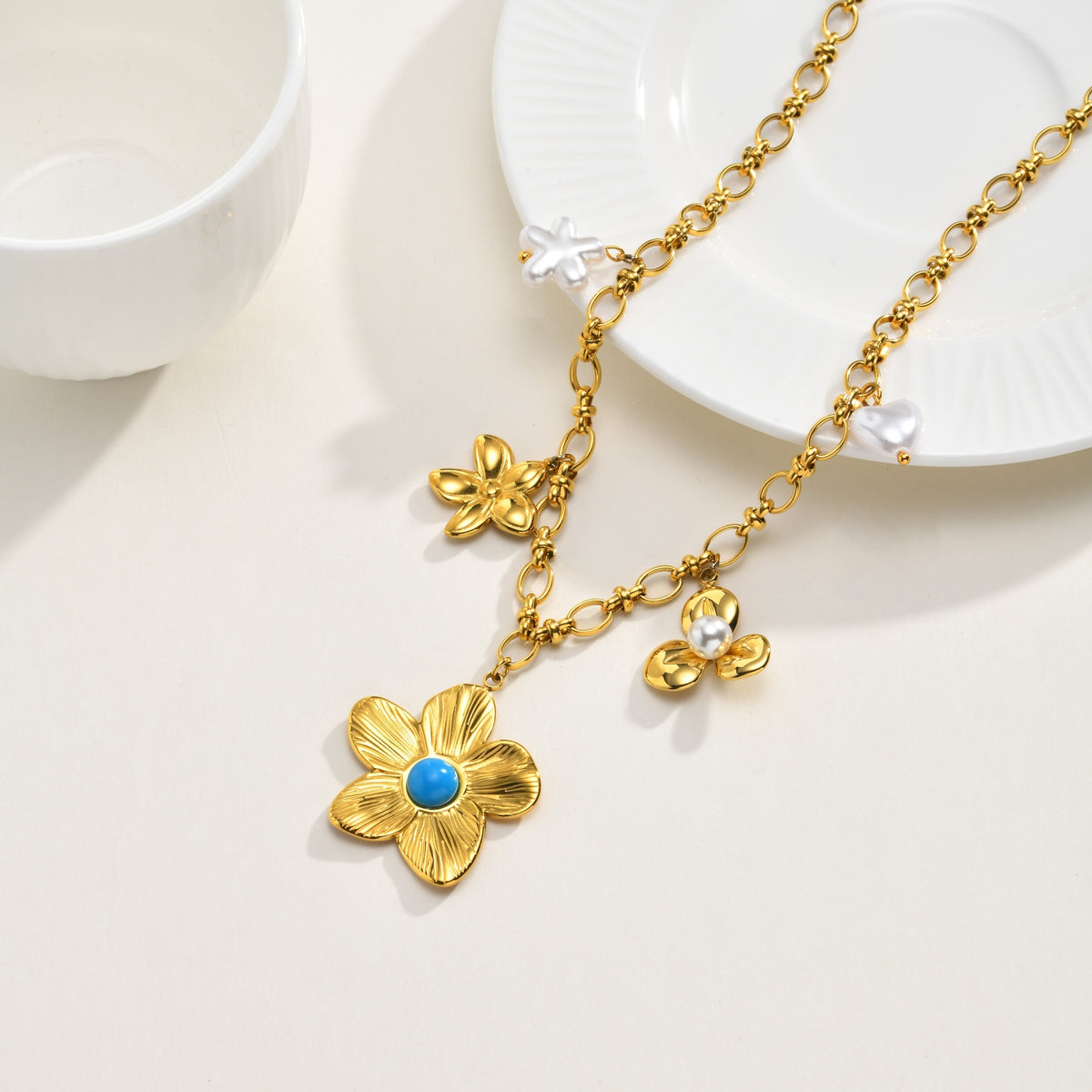 Gold-tone flower charm necklace in a closer product view