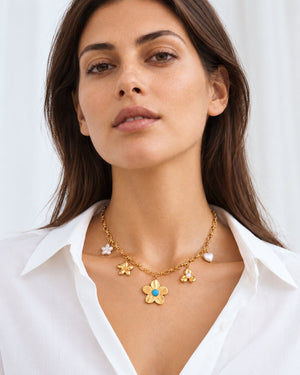 Flower Charm necklace worn at natural scale; AI-generated brand photograph