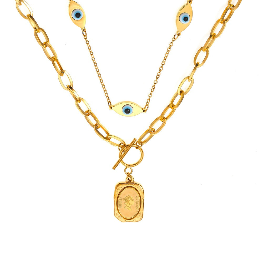 Gold-tone eye and coin necklace in a main product view