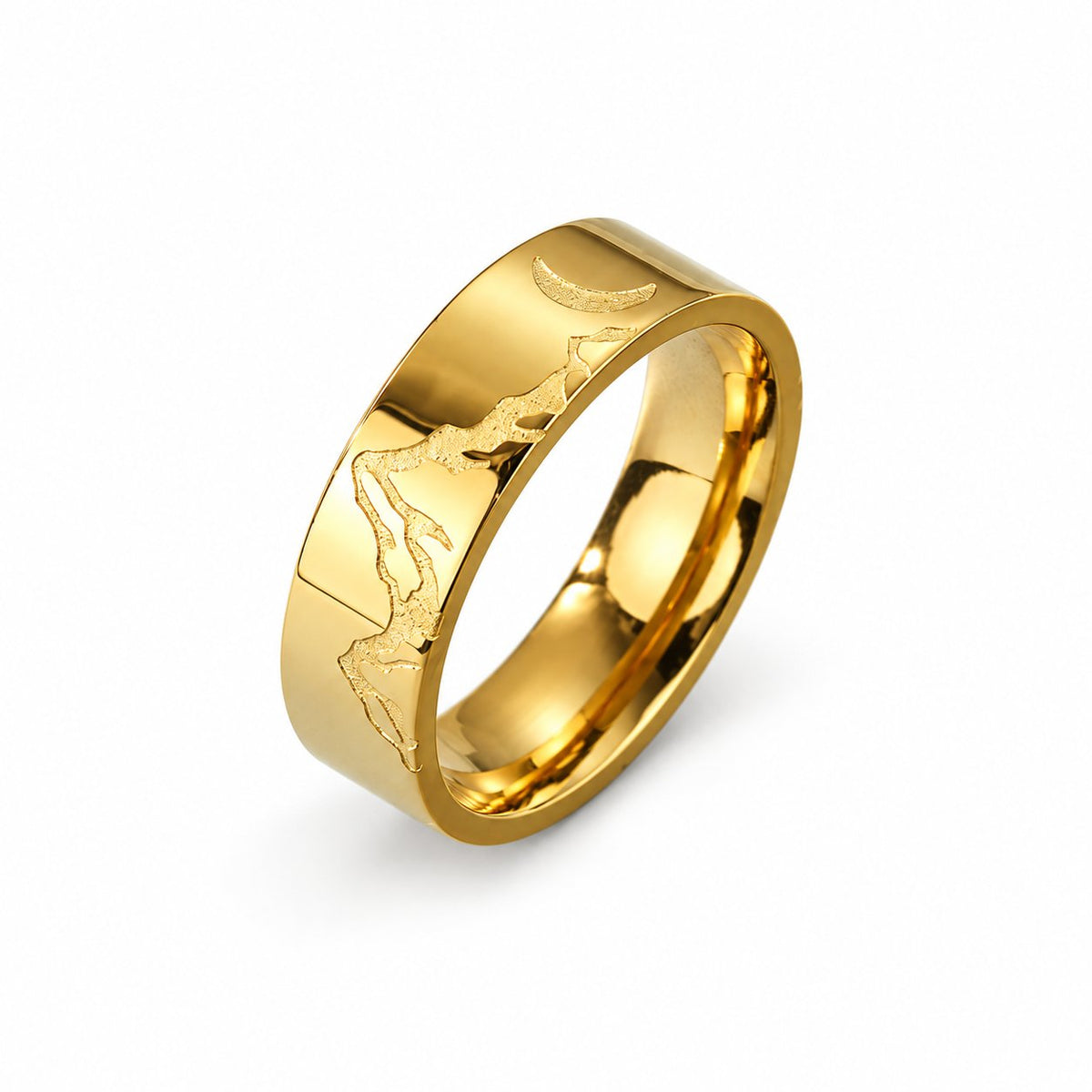 Gold-tone mountain and moon ring on a plain white background; AI-generated brand photograph