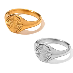 Gold-tone and silver-tone oval sunburst rings shown together