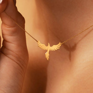 Gold-tone phoenix necklace in a detail product view