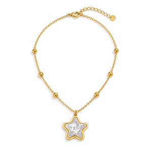 Gold-tone star necklace on a solid white background; AI-generated brand photograph