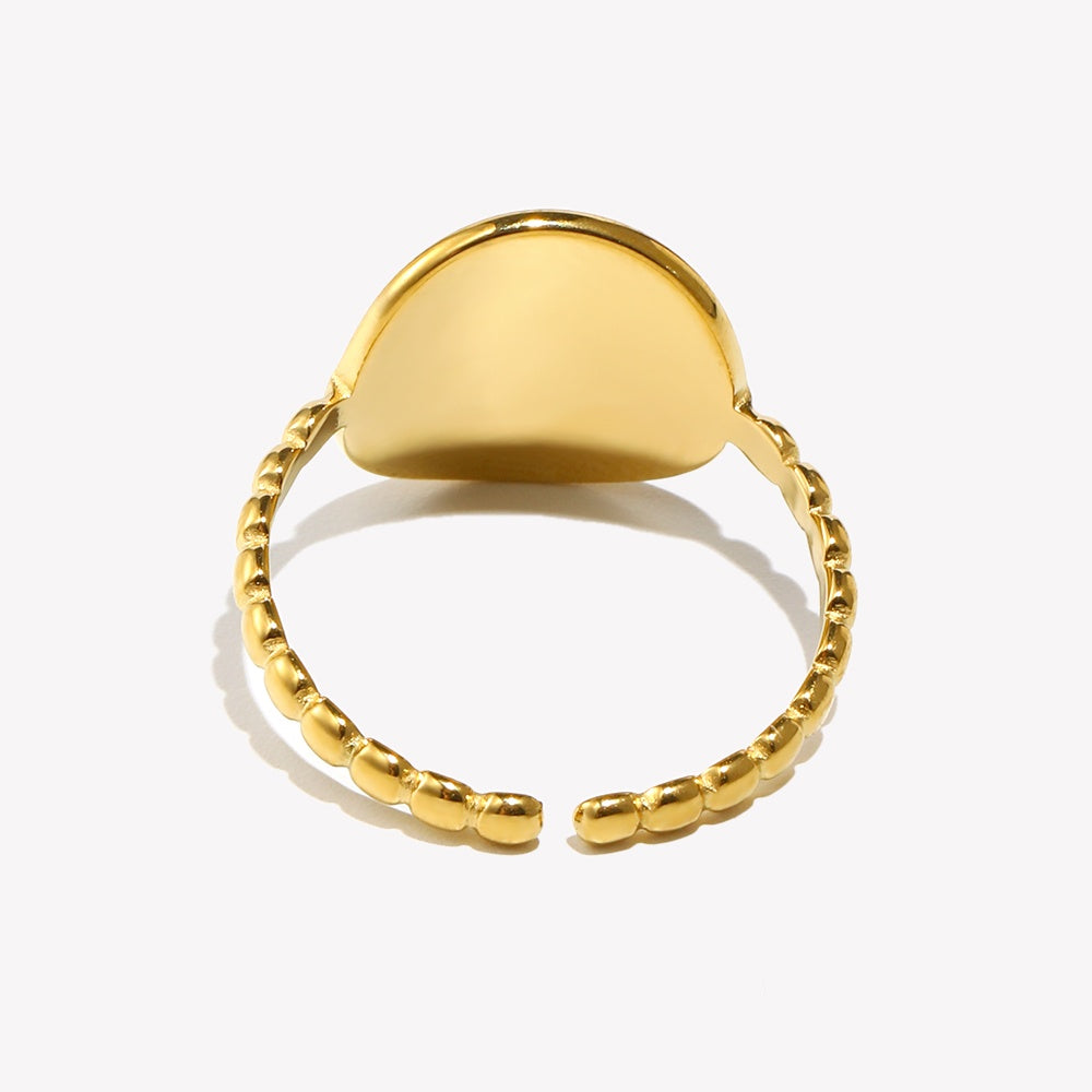 Gold-tone eight-point signet ring in a closer product view