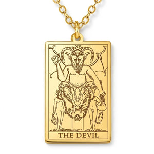 Close view of the gold The Devil engraved tarot-card pendant.