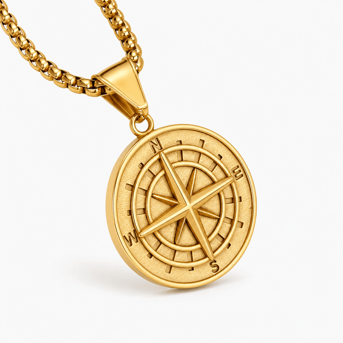 Gold-tone round compass-pattern pendant on a linked chain