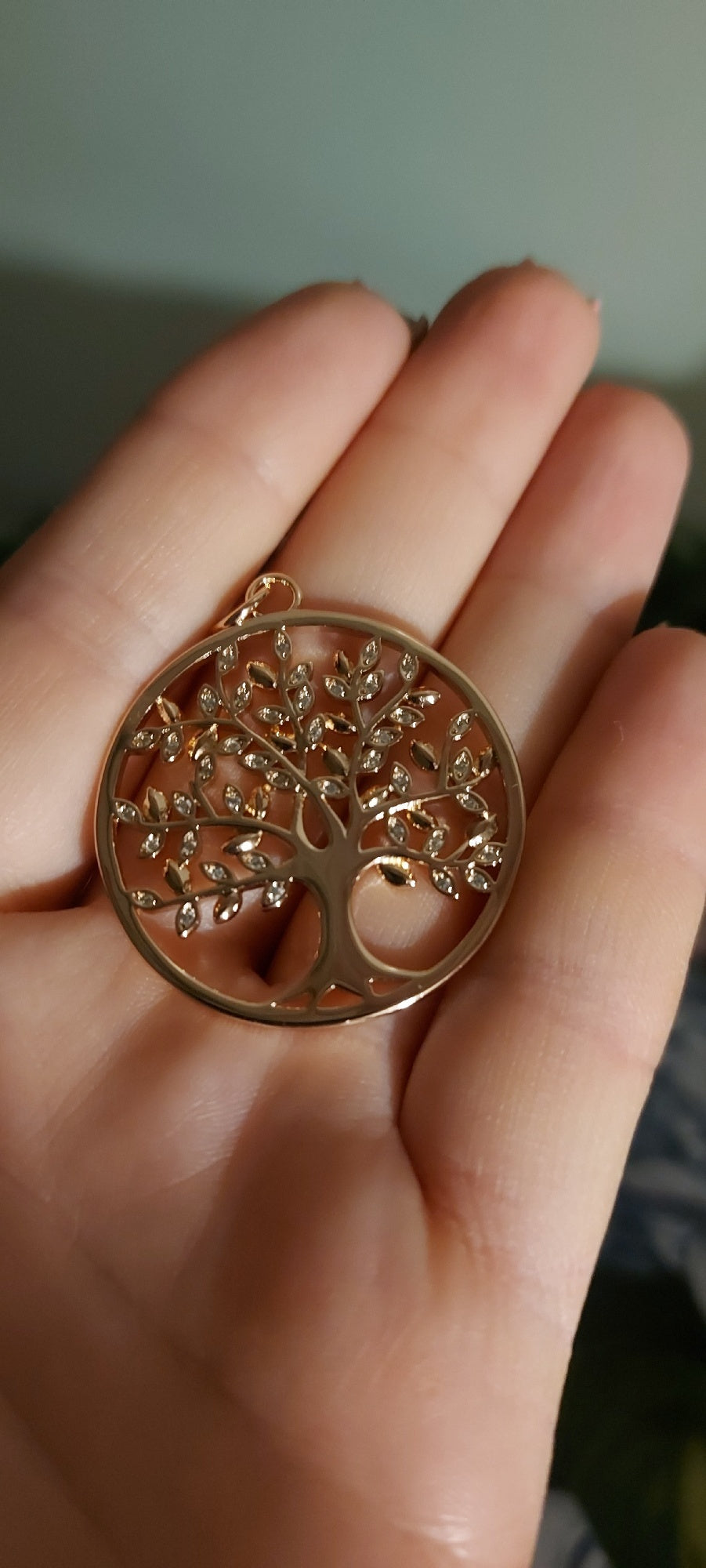 Rose Gold-tone openwork tree pendant in a detail product view